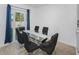 Bright dining room with glass table and six chairs at 2582 Glacier Express Ln, Tavares, FL 32778