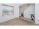 Bright entryway with tiled floor, glass-top table, and staircase at 2582 Glacier Express Ln, Tavares, FL 32778