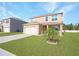 Two-story house, featuring a garage and manicured lawn at 2582 Glacier Express Ln, Tavares, FL 32778