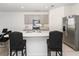 Modern kitchen with stainless steel appliances and an island at 2582 Glacier Express Ln, Tavares, FL 32778