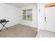 Spacious living room with neutral carpeting and large window at 2582 Glacier Express Ln, Tavares, FL 32778