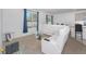 Living area featuring a sectional sofa and access to the kitchen at 2582 Glacier Express Ln, Tavares, FL 32778