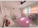 Peaceful Bedroom with crib, rocking chair, and pink rug at 301 E 26Th St, Sanford, FL 32773