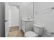 Clean bathroom with toilet, vanity, and mirror at 340 Belmond Dr, Debary, FL 32713