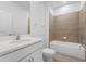 Clean bathroom with white vanity and taupe tile shower/tub combo at 340 Belmond Dr, Debary, FL 32713