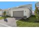 Attached garage with paver driveway and landscaping at 340 Belmond Dr, Debary, FL 32713