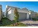 Attached garage with paver driveway and landscaping at 340 Belmond Dr, Debary, FL 32713