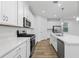 Modern kitchen with white cabinets, stainless steel appliances, and an island at 340 Belmond Dr, Debary, FL 32713