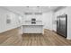Modern kitchen with white cabinets, stainless steel appliances, and an island at 340 Belmond Dr, Debary, FL 32713