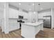 Modern kitchen with white cabinets and large island at 340 Belmond Dr, Debary, FL 32713