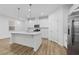 Modern kitchen with white cabinets and stainless steel appliances at 340 Belmond Dr, Debary, FL 32713