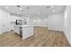Modern kitchen with white cabinets, island, and stainless steel appliances at 340 Belmond Dr, Debary, FL 32713