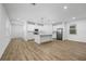 Open concept kitchen with white cabinets and island at 340 Belmond Dr, Debary, FL 32713