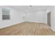 Bright and airy living room with wood-look flooring and access to patio at 340 Belmond Dr, Debary, FL 32713