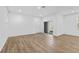 Open living area with sliding glass door and wood-look floors at 340 Belmond Dr, Debary, FL 32713