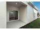 Covered patio with sliding glass doors leading to the interior at 340 Belmond Dr, Debary, FL 32713