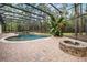 Inviting backyard features a screened pool, fire pit, and patio for outdoor enjoyment at 943 Elm Harbor Ct, Lake Mary, FL 32746