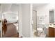 Bathroom showing shower, toilet, vanity, and doorway into the bonus room at 943 Elm Harbor Ct, Lake Mary, FL 32746