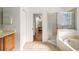 Bright bathroom featuring a shower, soaking tub, and vanity with lots of space at 943 Elm Harbor Ct, Lake Mary, FL 32746