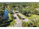 Aerial view of the community entrance, water features, and lush landscaping at 943 Elm Harbor Ct, Lake Mary, FL 32746