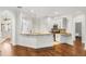 Open kitchen and breakfast bar with granite counters and stainless steel appliances at 943 Elm Harbor Ct, Lake Mary, FL 32746