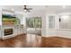Comfortable living room with fireplace, built-in shelves, and access to outdoor patio at 943 Elm Harbor Ct, Lake Mary, FL 32746