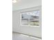 Bright bedroom with large window and neutral walls at 5166 Minneola Ln, Saint Cloud, FL 34772