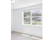 Spacious bedroom with large window and wood-look flooring at 5166 Minneola Ln, Saint Cloud, FL 34772