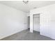 Simple bedroom with closet and neutral wall colors at 5166 Minneola Ln, Saint Cloud, FL 34772