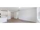 Modern kitchen with white cabinets, island, and stainless steel appliances at 5166 Minneola Ln, Saint Cloud, FL 34772