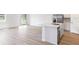 Open concept kitchen with island and stainless steel appliances at 5166 Minneola Ln, Saint Cloud, FL 34772