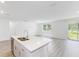 Modern kitchen island with double sink and white countertop at 5166 Minneola Ln, Saint Cloud, FL 34772