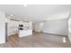 Open concept kitchen and dining area with light wood flooring at 5166 Minneola Ln, Saint Cloud, FL 34772