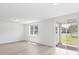 Bright living room with sliding glass doors leading to backyard at 5166 Minneola Ln, Saint Cloud, FL 34772