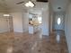Open-concept view of the home's entryway, living area, and kitchen with ceramic tile flooring at 8749 Se 159Th Ln, Summerfield, FL 34491