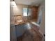Main bathroom features a double sink, granite countertops, ceramic tile floors, and a glass-enclosed shower at 8749 Se 159Th Ln, Summerfield, FL 34491