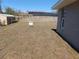 View of side yard with evidence of future garage to be installed soon with staked-off land at 8749 Se 159Th Ln, Summerfield, FL 34491