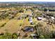 Aerial view of property showing home, outbuildings, and pond at 3330 La Salle Ave, Saint Cloud, FL 34772