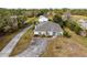 Aerial view of house with detached garage and curved driveway at 3330 La Salle Ave, Saint Cloud, FL 34772