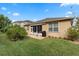 Backyard view with lush lawn and outdoor patio area with furniture at 5307 Cortland Dr, Davenport, FL 33837