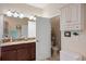 Bathroom featuring granite counters, decorative lighting, and a separate water closet at 5307 Cortland Dr, Davenport, FL 33837