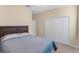 Neutral bedroom with comfortable bed, closet, and neutral decor at 5307 Cortland Dr, Davenport, FL 33837