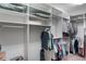 Walk-in closet with custom shelves, hanging racks, and ample storage space at 5307 Cortland Dr, Davenport, FL 33837