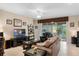Inviting living room with sliding glass doors to lanai and comfortable seating at 5307 Cortland Dr, Davenport, FL 33837