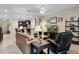 Comfortable living room with tile floors and views of kitchen area at 5307 Cortland Dr, Davenport, FL 33837