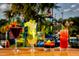 Image of different drink concoctions sitting atop a table at an aquapark at 7763 Westland Dr, Kissimmee, FL 34747