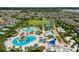 Aerial shot of luxurious resort-style water park with pools, water slides and comfortable lounge chairs at 7763 Westland Dr, Kissimmee, FL 34747