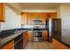 Kitchen with stainless steel appliances, granite countertops, and oak cabinets at 13910 Dove Wing Ct, Orlando, FL 32828
