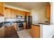Kitchen featuring stainless steel appliances and granite countertops at 13910 Dove Wing Ct, Orlando, FL 32828