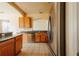 Galley kitchen with stainless steel appliances and tile floors at 13910 Dove Wing Ct, Orlando, FL 32828